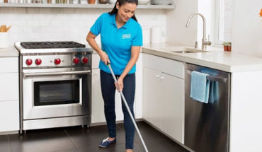 woman cleaning airbnb rental